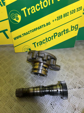 TRANSMISSION FRONT COVER/OIL PUMP WITH SHAFT FOR  POWER SHIFT (used) - John Deere 7010, 7000